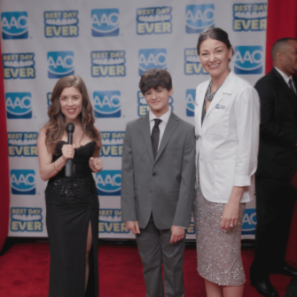Teenage boy on the red carpet with the host and his orthodontists talking about how getting your braces off at the orthodontist office is the best day ever!
