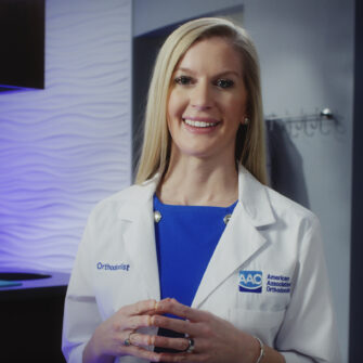 An orthodontist educating patients that any age is appropriate to get orthodontic treatment.